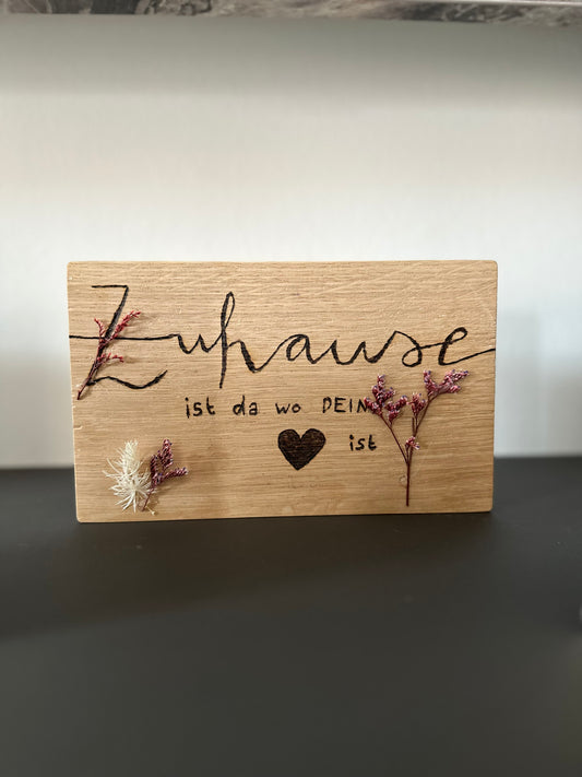 Holzschild mit Schriftzug
